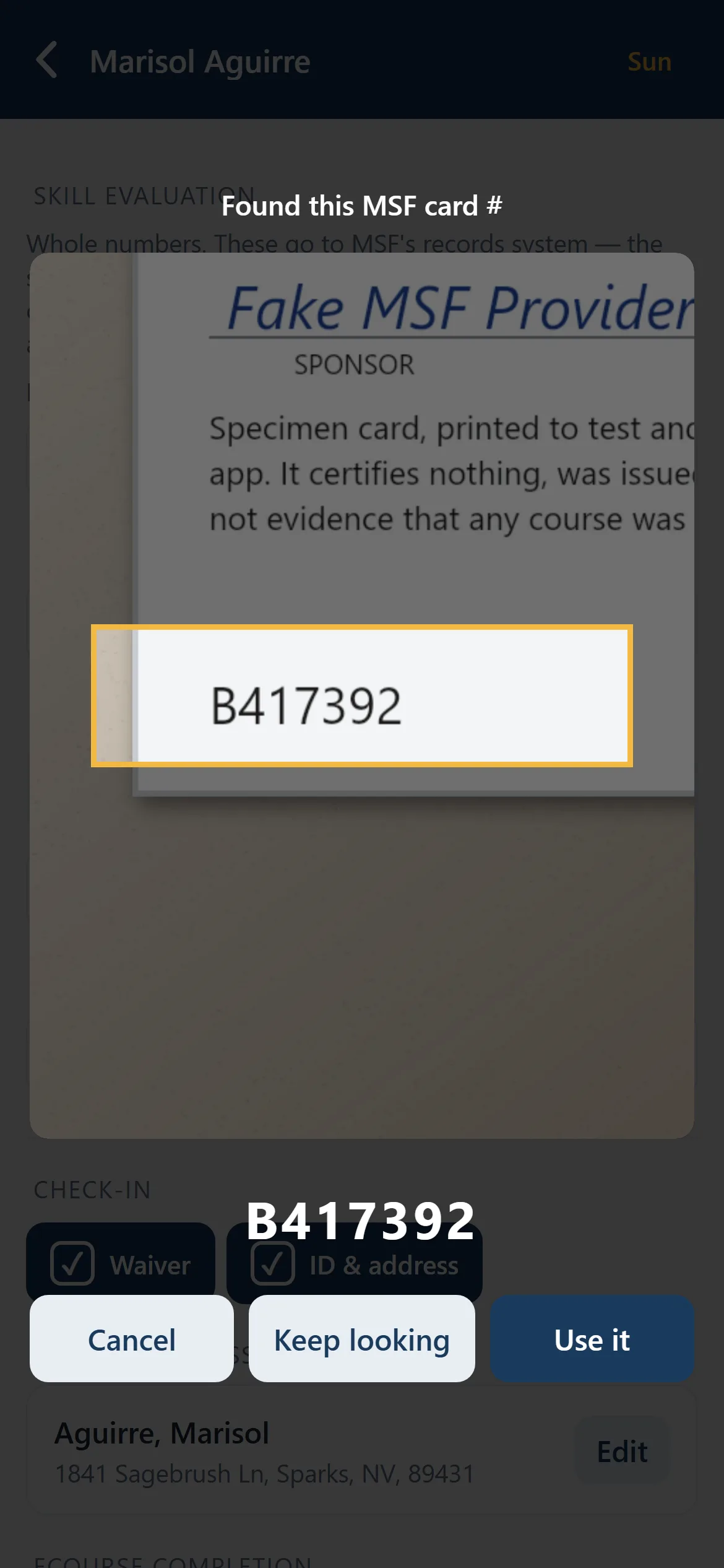 The camera has read a card number off a specimen card and is offering it for confirmation, with Keep looking and Use it.